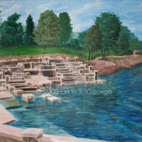 Digital image of original acrylic painting by Linda Eileen S. George a.k.a "Lin" George on canvas entitled 'Monte Ne'; 24" h x 30" w, a summer scene depicting the ruins of the old 20's-40's era amphitheater designed by Coin Harvey at Monte Ne, Arkansas, an interesting old relic of concrete couches, chairs, tables and stairs that occasionally see light when the level of Beaver Lake, a man-made lake that flooded the area in the 60's, is very low; in the background are visible a few trees, scattered buildings, a receding shoreline and a blue summer sky; in the foreground the ruins wrap around the water where some underwater features are still visible through the rippling blue water that's just as active and textural as the loose clouds blowing across the sky